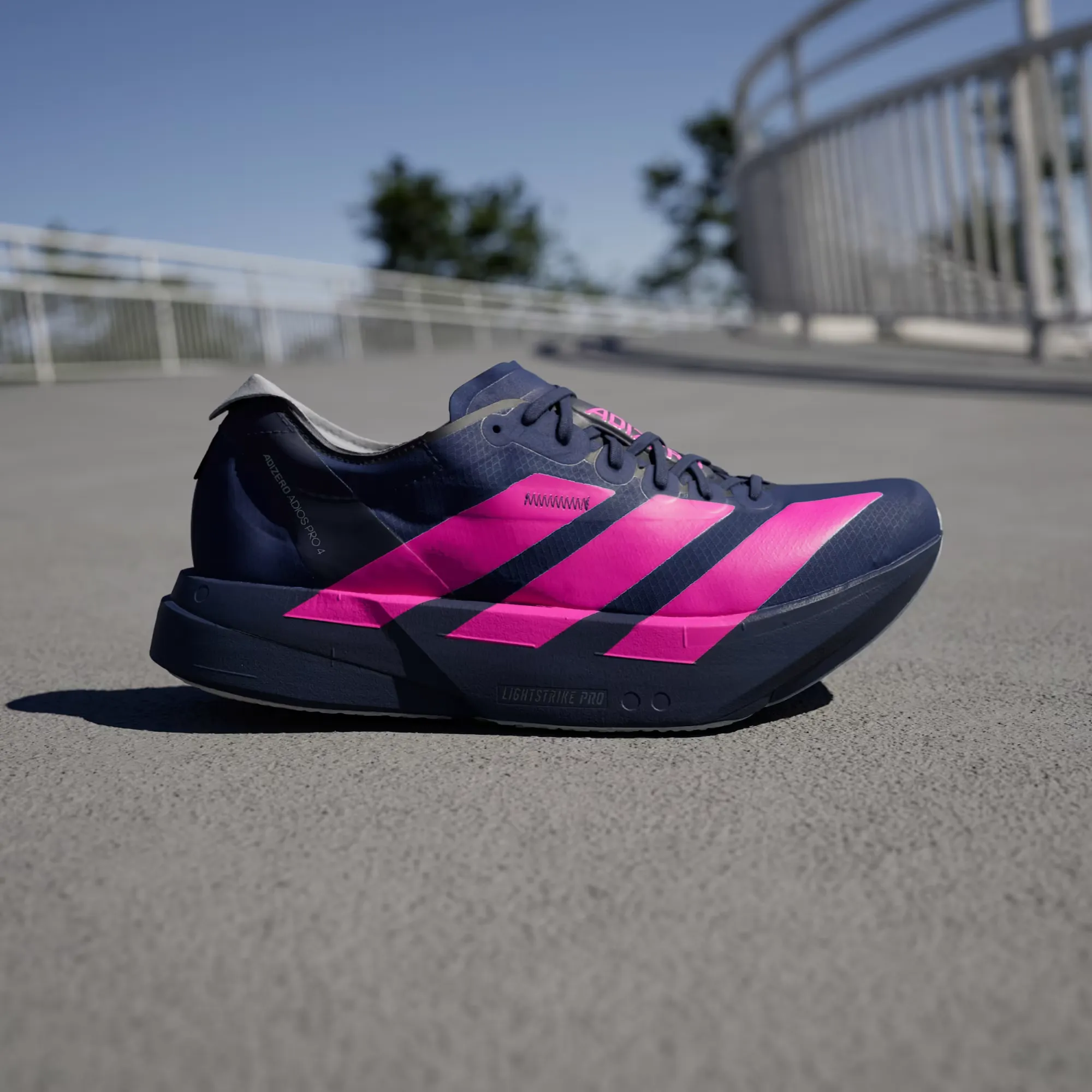 E72FA1_adidas-Adizero-Adios-Pro-4_DARK-BLUE-SHOCK-PINK_JR4946_img1