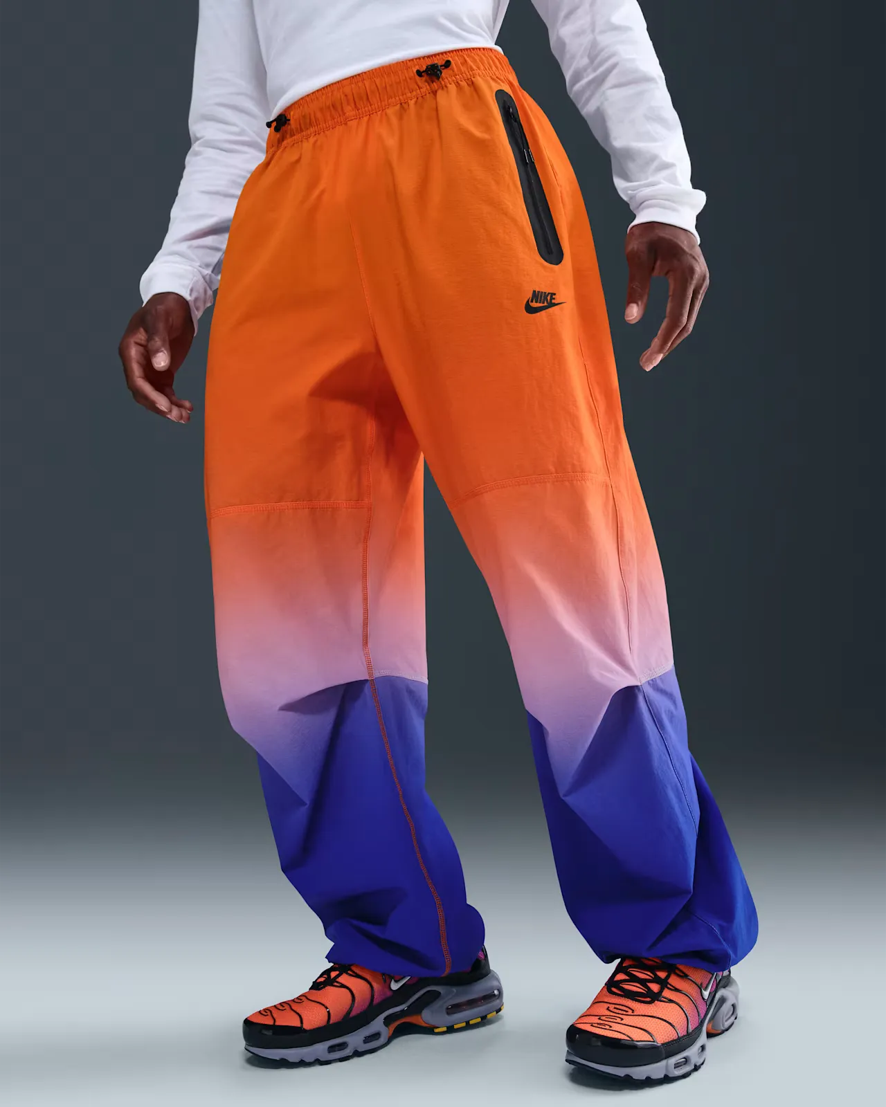 1E1D78_Nike-Tech-Woven-Pants_VIVID-ORANGE-GAME-ROYAL_II4634-480_img0