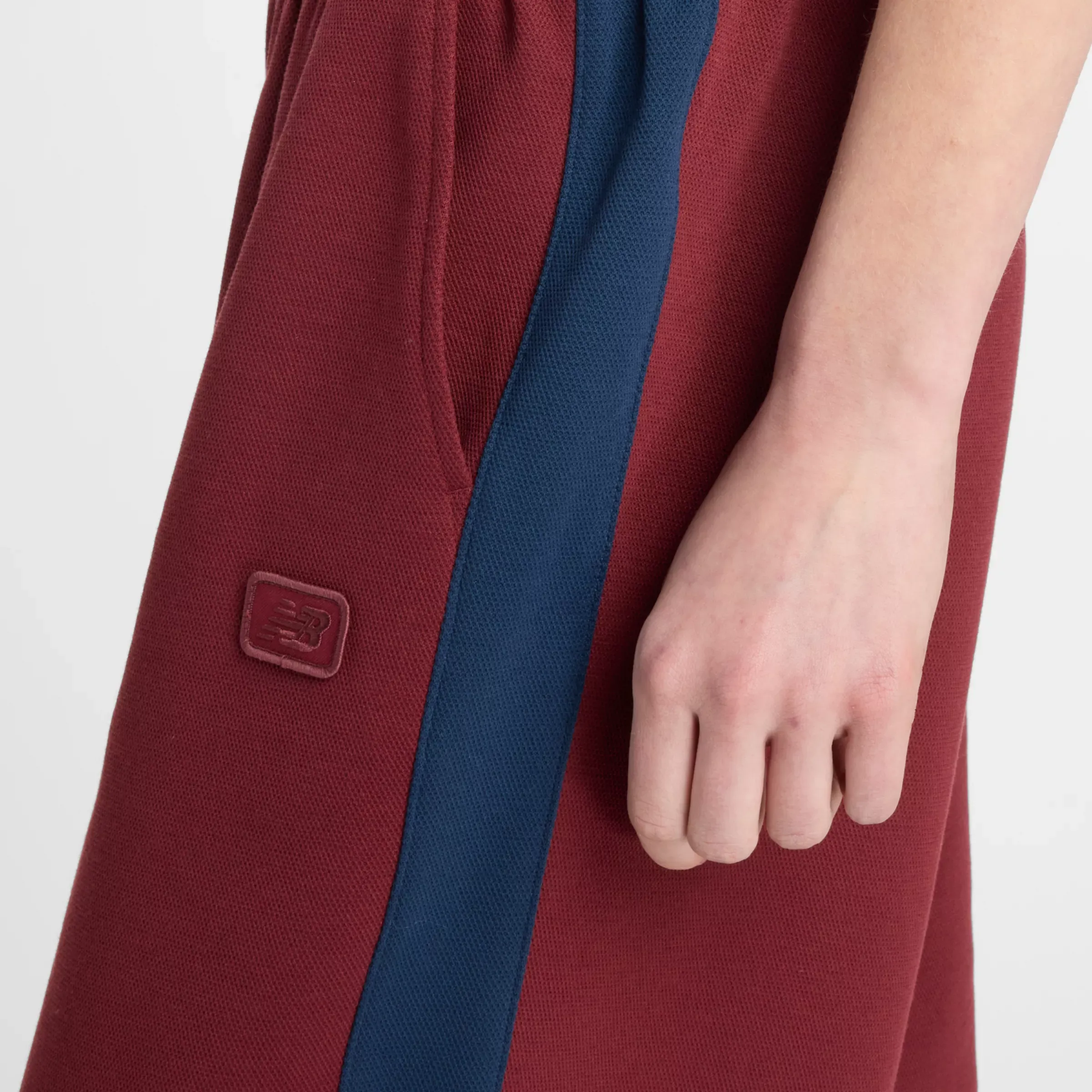 722731_New-Balance-Post-Season-Pique-Track-Pant-WMNS_MONARCH-BURGUNDY_WP53501MHB_img4