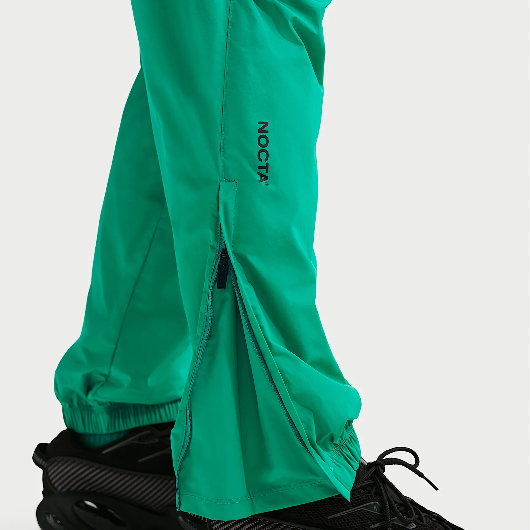 1FB491_Nocta-x-Nike-Nylon-Track-Pant_NEPTUNE-GREEN-BLACK_FN7668-340_img6