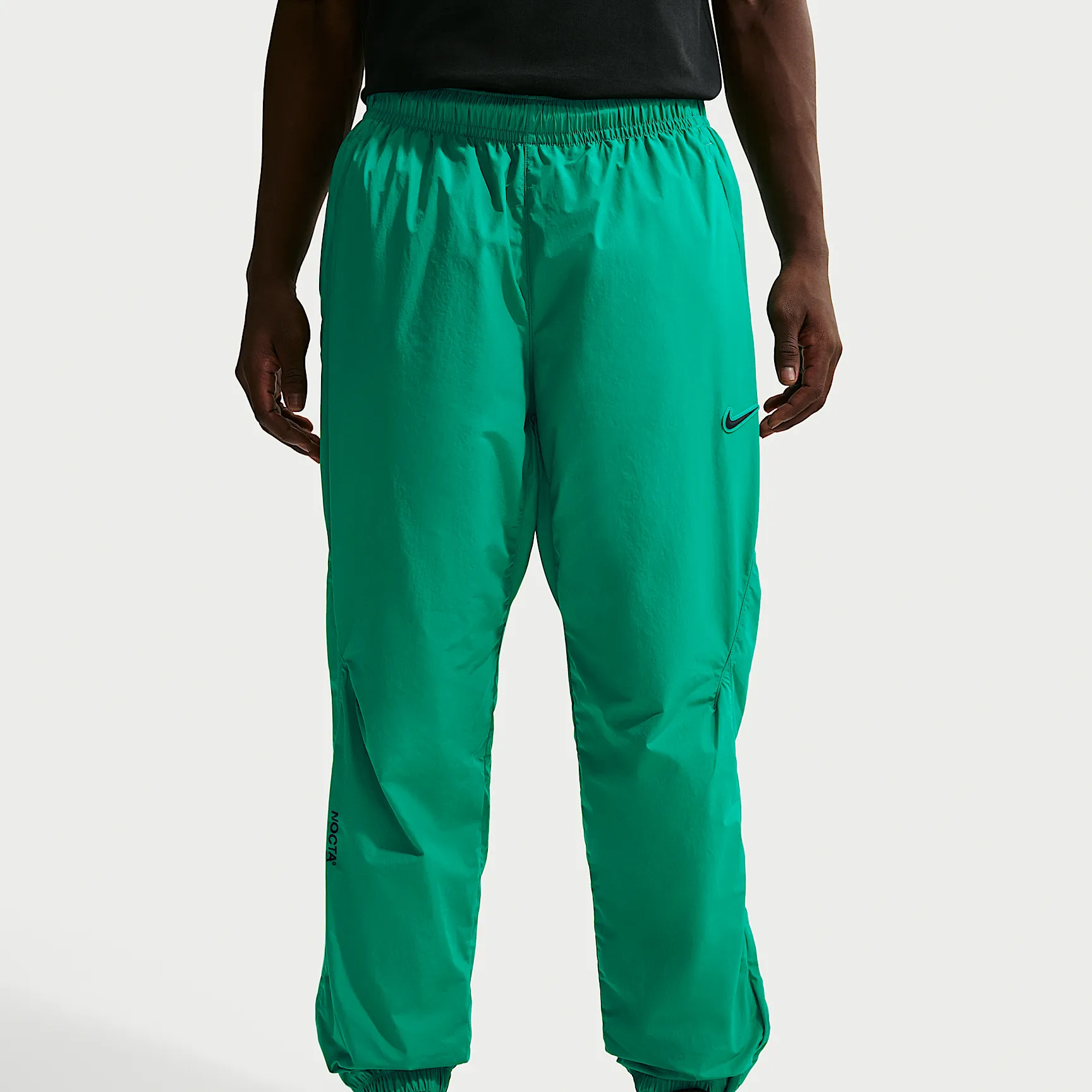 1FB491_Nocta-x-Nike-Nylon-Track-Pant_NEPTUNE-GREEN-BLACK_FN7668-340_img0