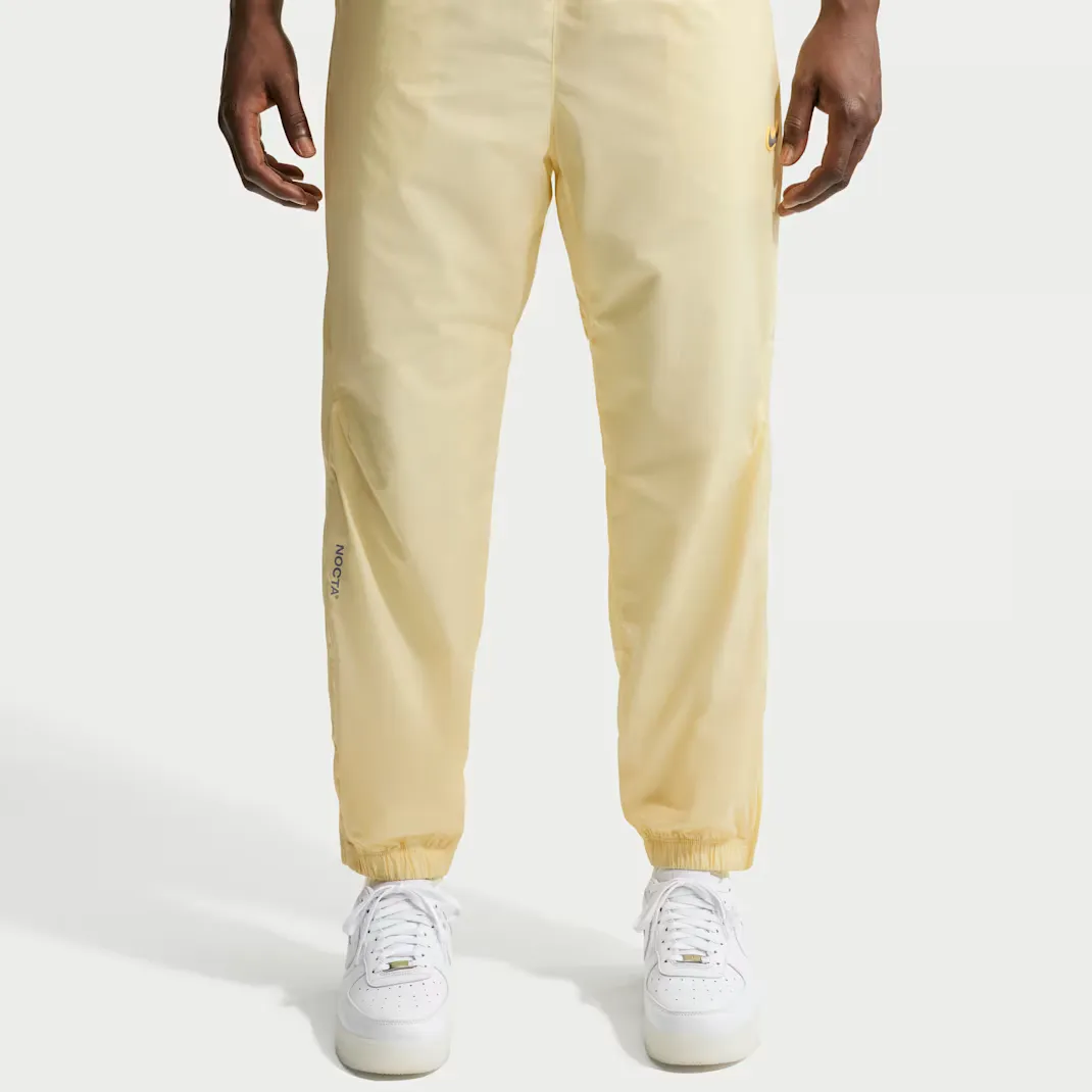 Nocta-x-Nike-Northstar-Nylon-Track-Pants_Alabaster_FN7668-744_img1