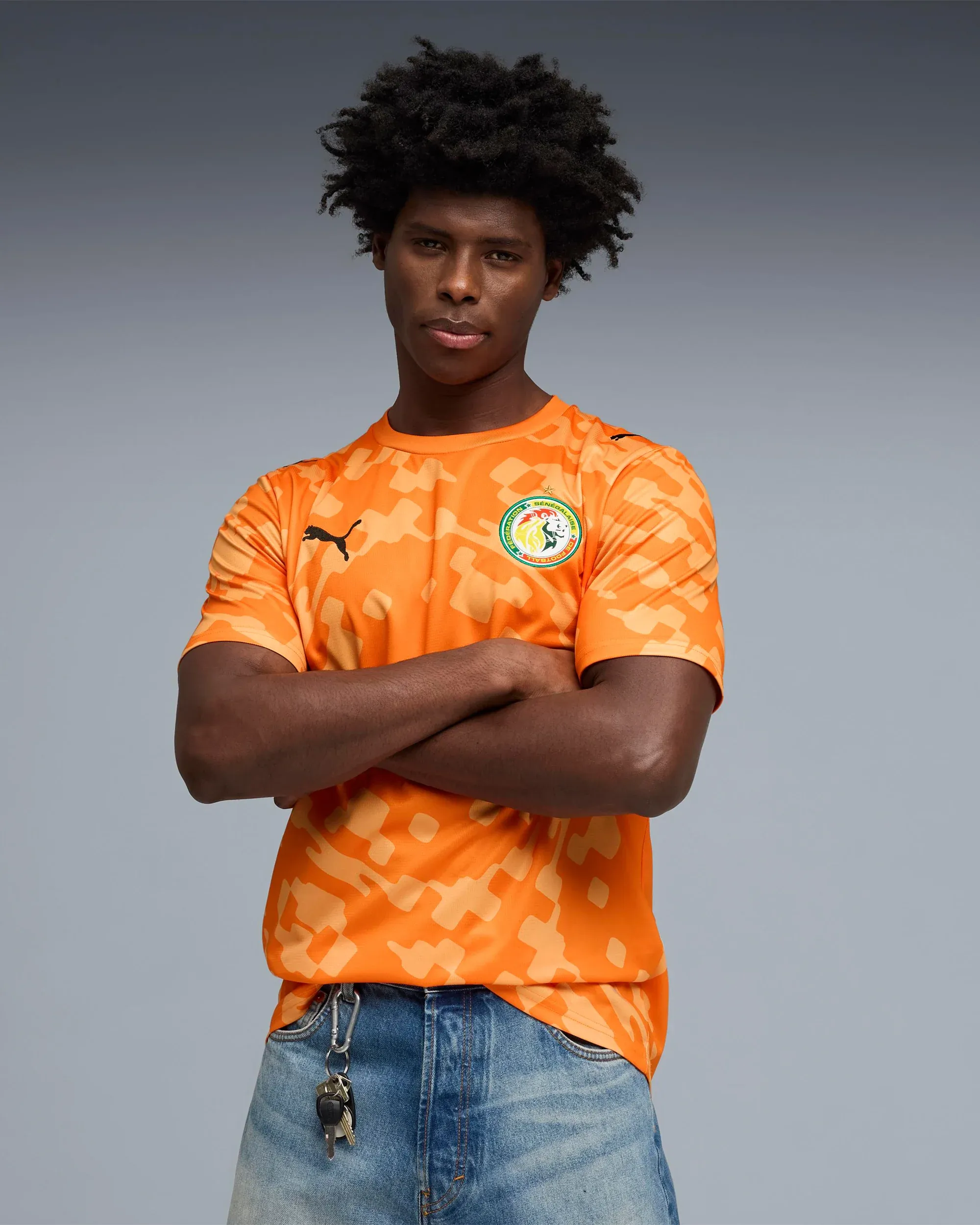 000000_Puma-x-Salehe-Bembury-x-Senegal-Goalkeepers-Logo-Jersey-T-Shirt_Orange_787109-87_img1