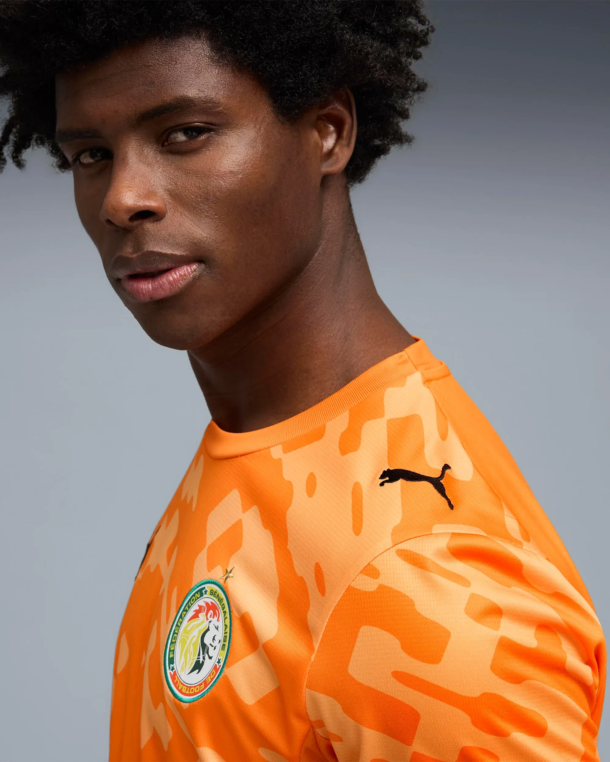 000000_Puma-x-Salehe-Bembury-x-Senegal-Goalkeepers-Logo-Jersey-T-Shirt_Orange_787109-87_img5