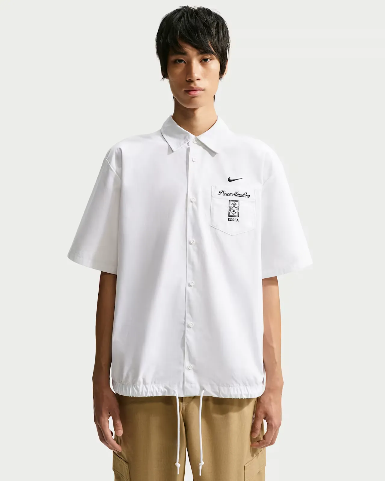 PEACEMINUSONE-x-South-Korea-x-Nike-Short-Sleeve-Top_White_IM3219-100_img1