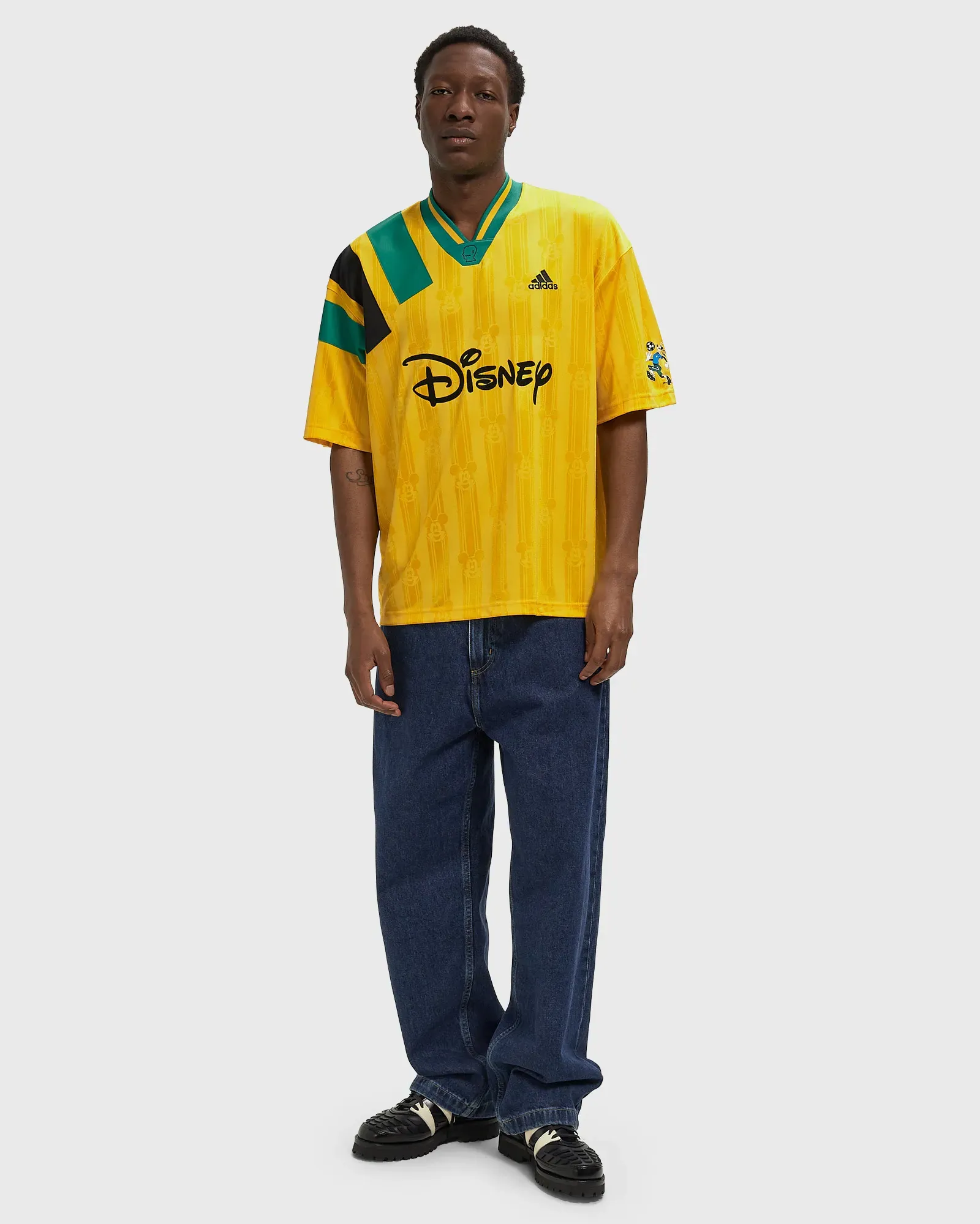 000000_adidas-x-Brain-Dead-x-Disney-Football-Jersey_Bold-Gold_KR5195_img1