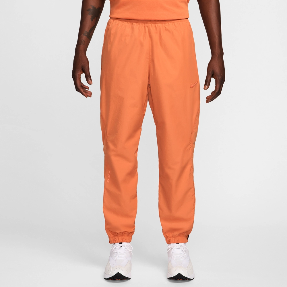 FF9D6A_NOCTA-x-NikeLab-Nylon-Track-Pants_HOT-CURRY-ORANGE-TRANCE_FN7668-808_img1