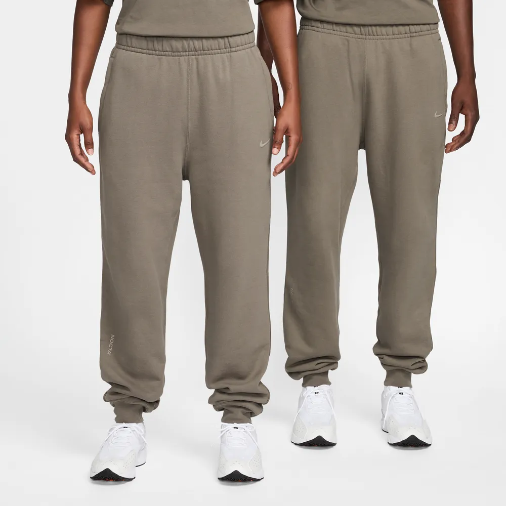 6F6156_NOCTA-x-Nike-Fleece-Joggers_BROWN-GREY_FN7661-040_img0