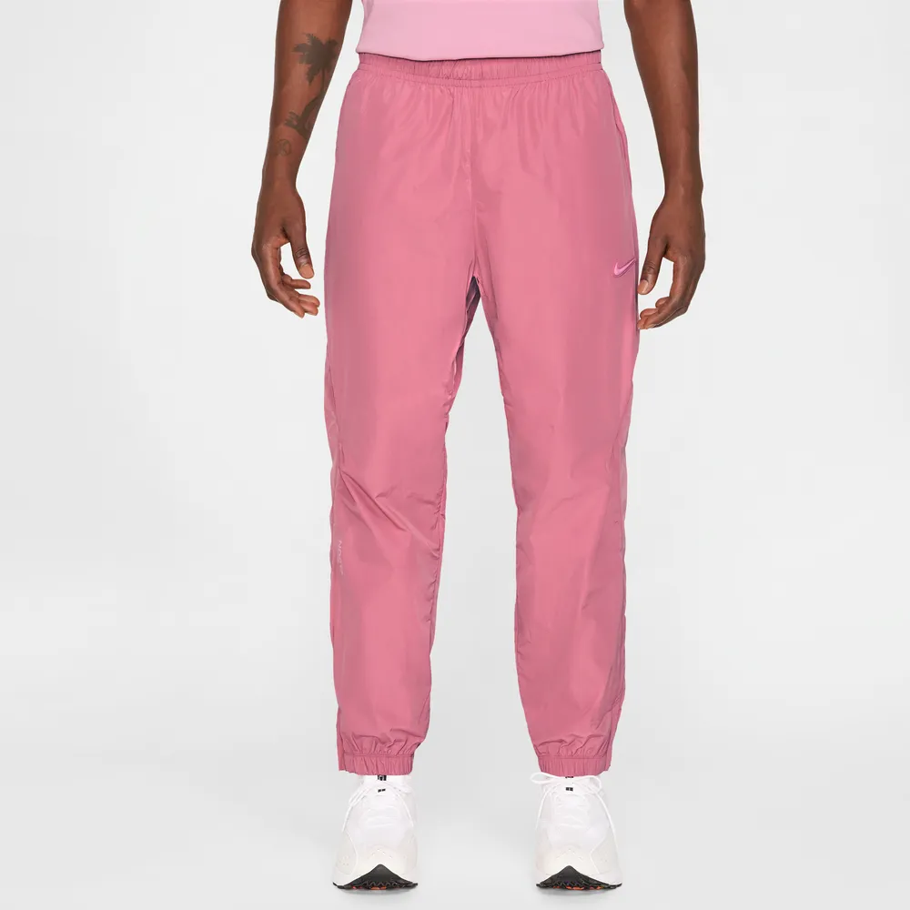 C37A86_NOCTA-x-Nike-Nylon-Track-Pant_DESERT-BERRY_FN7668-667_img1
