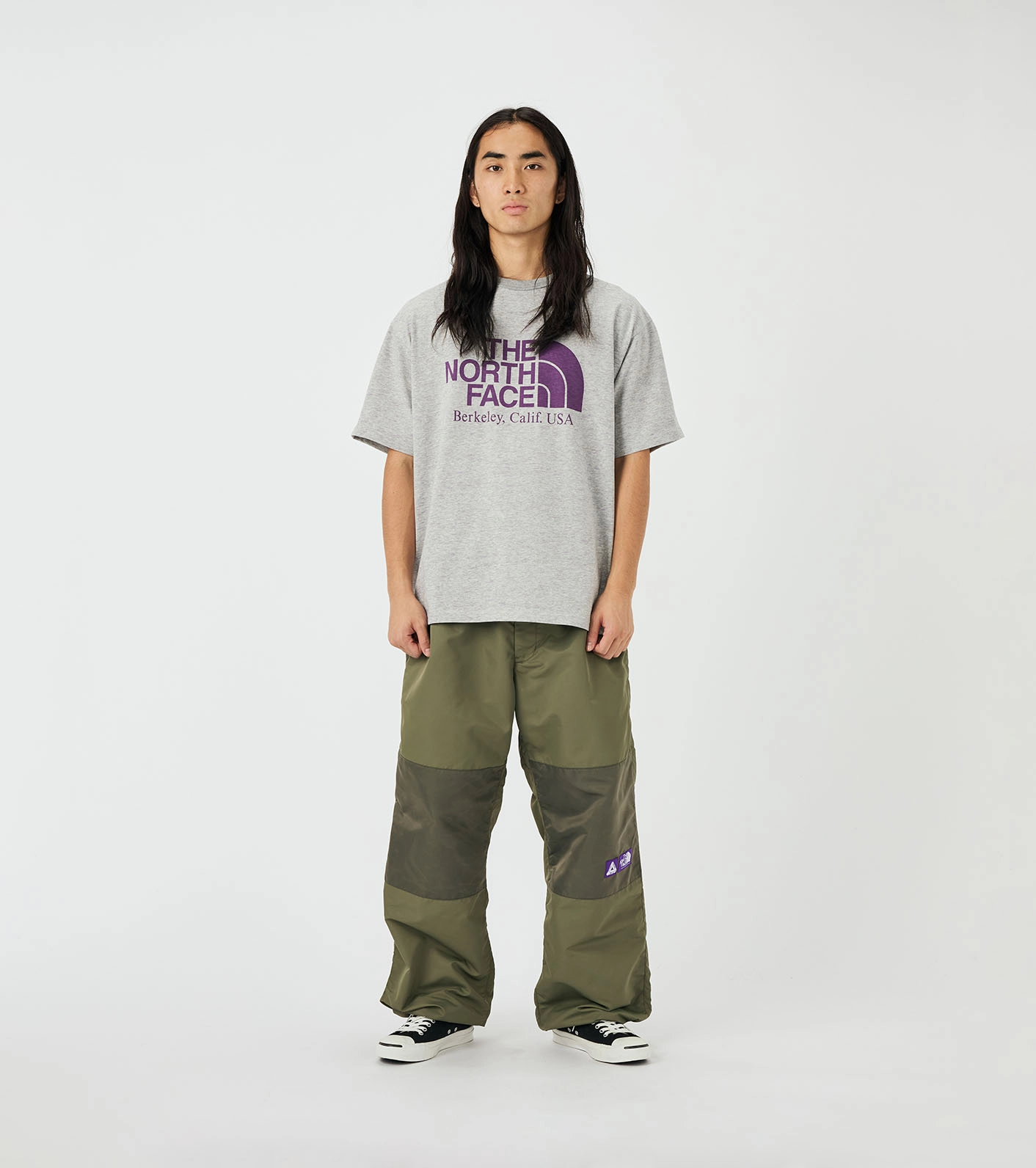 Mannequin wearing gray t-shirt The North Face Purple Label x Palace with purple logo