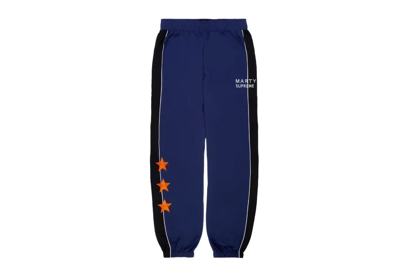 Blue Nahmias Marty Supreme pants with orange stars and white details