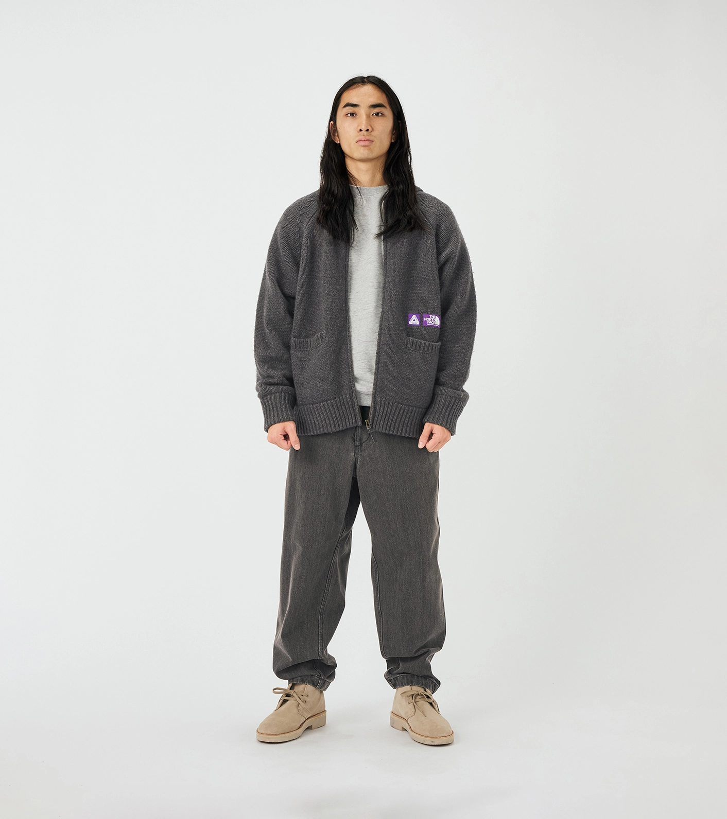 Mannequin wearing gray jacket The North Face Purple Label x Palace with purple logo