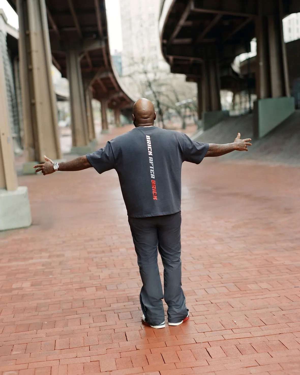 Jeezy with arms open in a Brick After Brick t-shirt