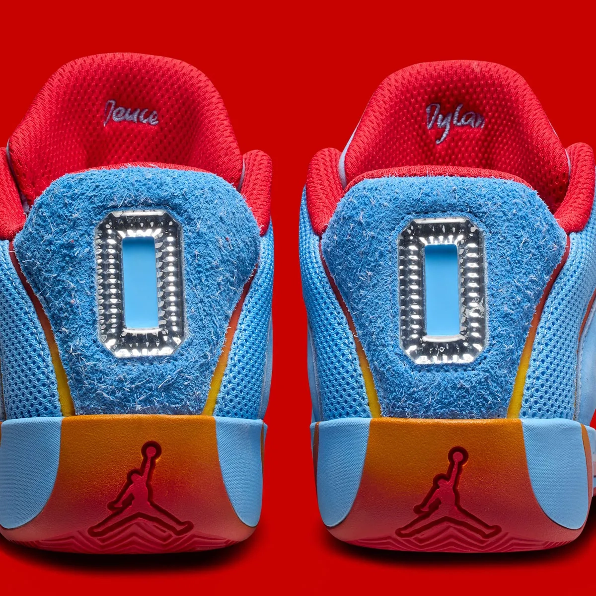 sneakers Jordan Tatum 1 blue and red with number 0 on the back on a red background