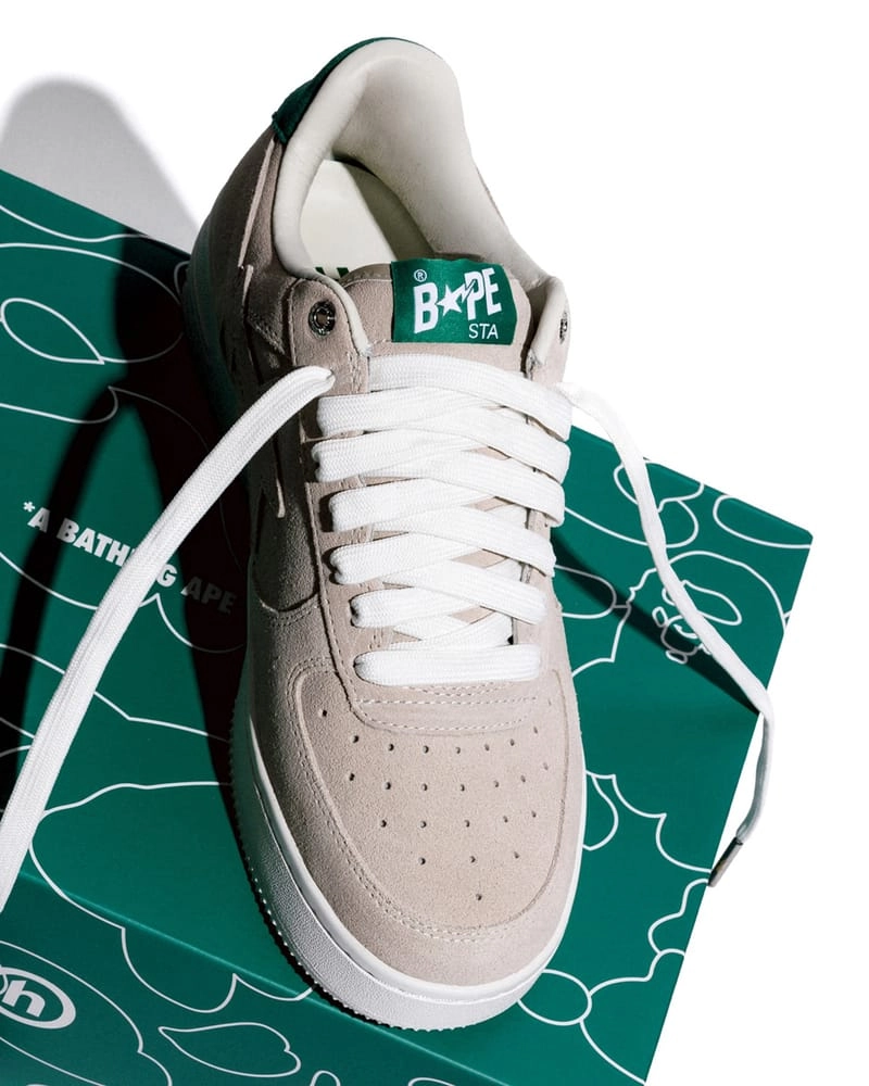 BAPE STA Hidden NY in beige suede with green tongue placed on a BAPE box