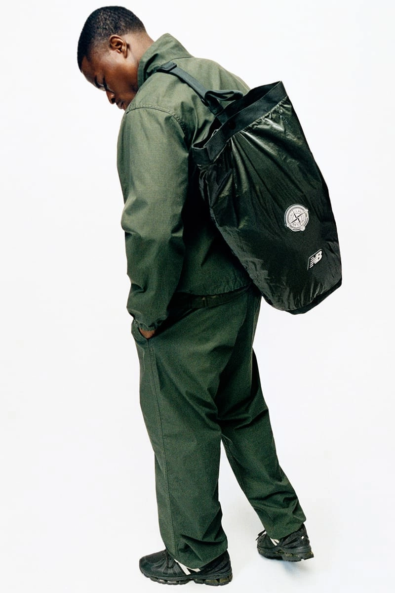 Mannequin with a nylon backpack and green Stone Island x New Balance tracksuit