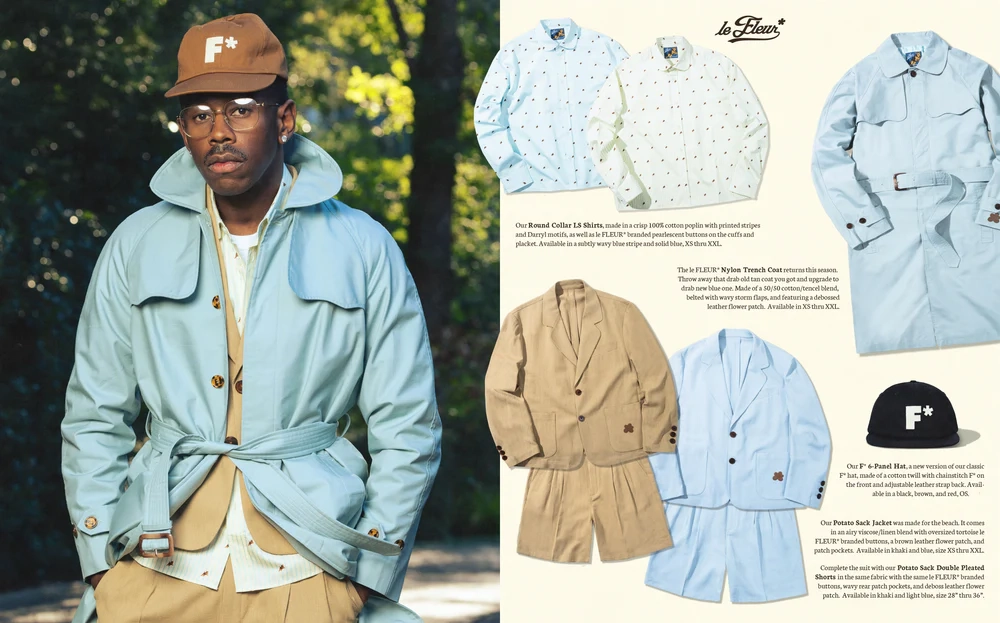 Tyler the creator portant un pardessus bleu clair et chapeau marron dans une forêt avec des vêtements Le Fleur saison 4