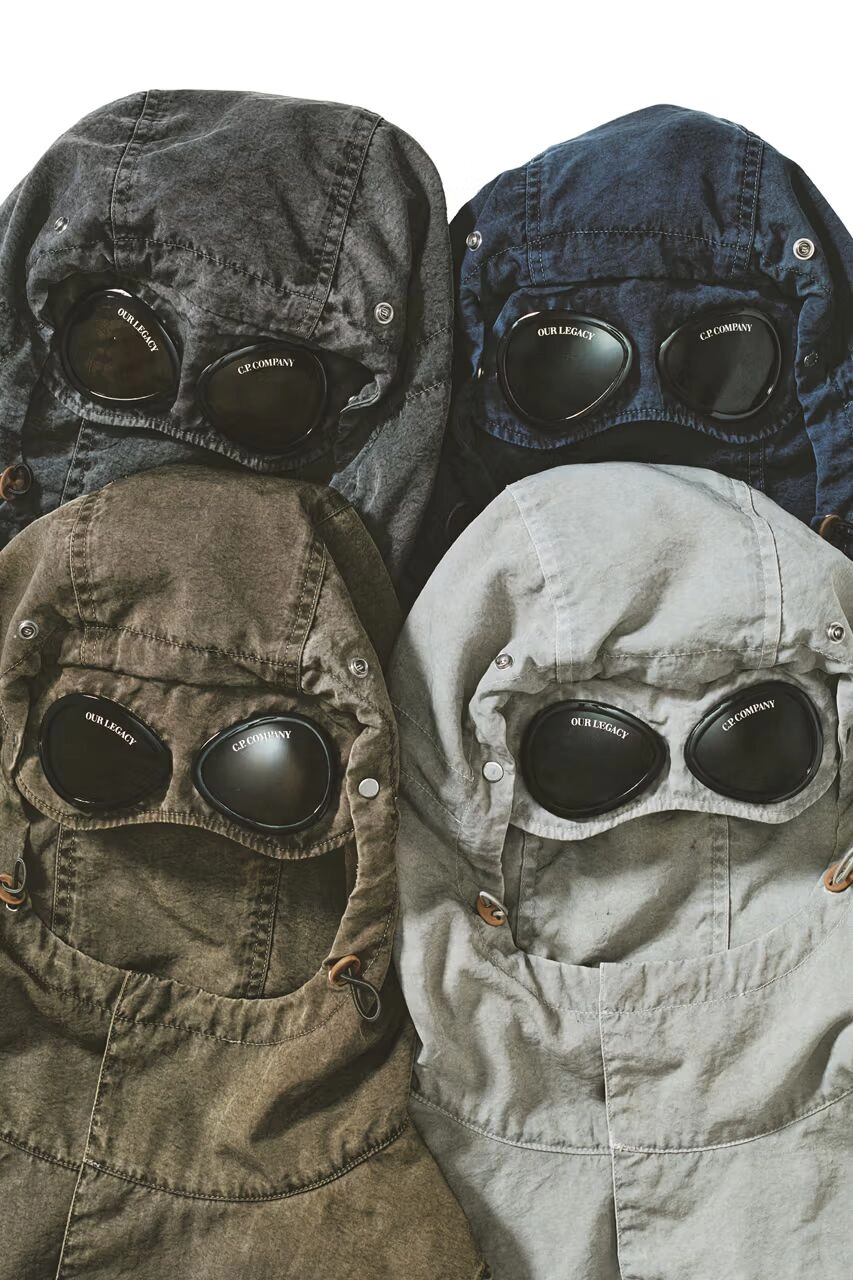 Quatre capsules de C.P. Company x Our Legacy FW25 en différentes couleurs avec lunettes intégrées, sur fond blanc