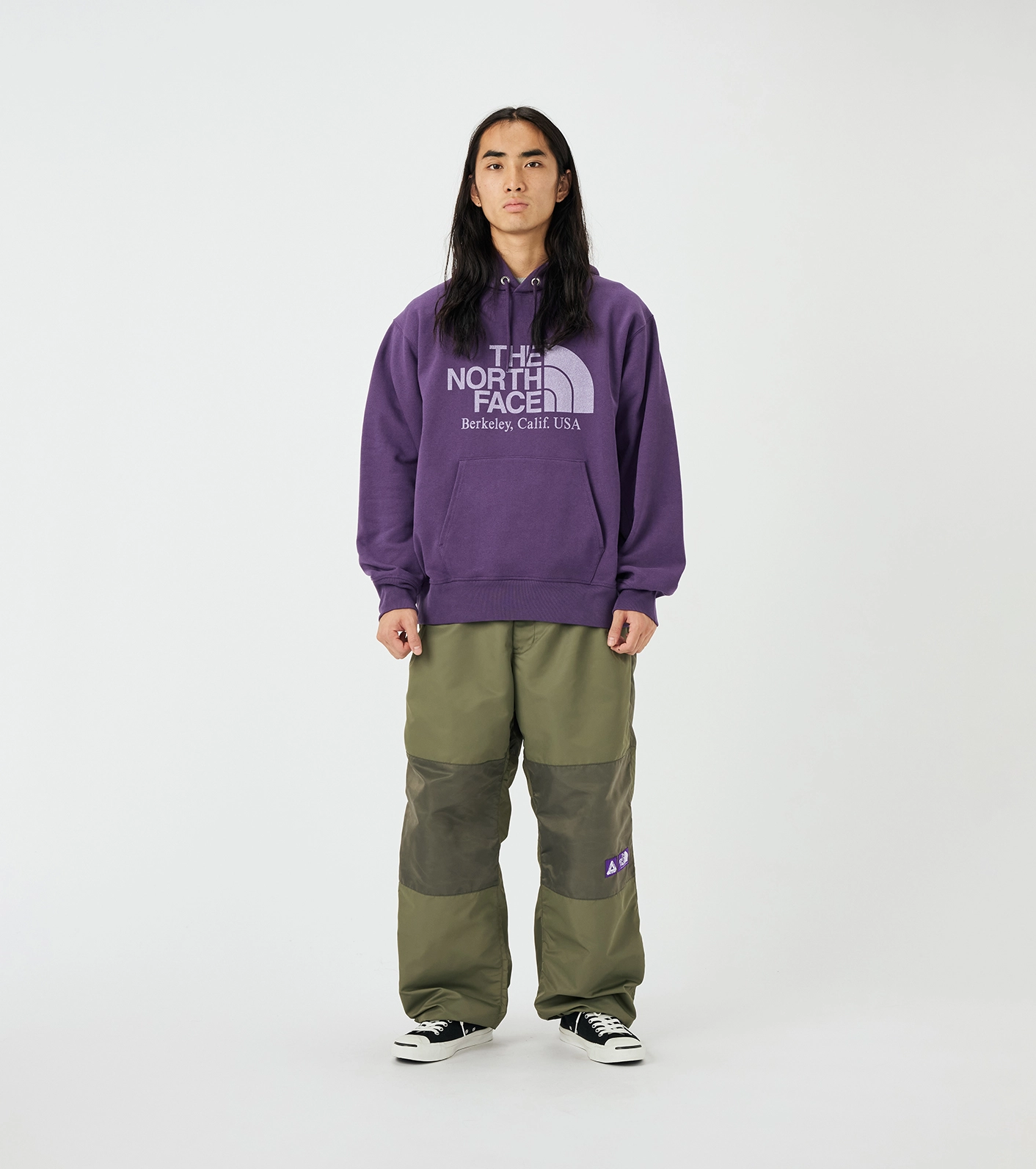 Hoodie The North Face Purple Label in purple worn by mannequin with green pants on white background