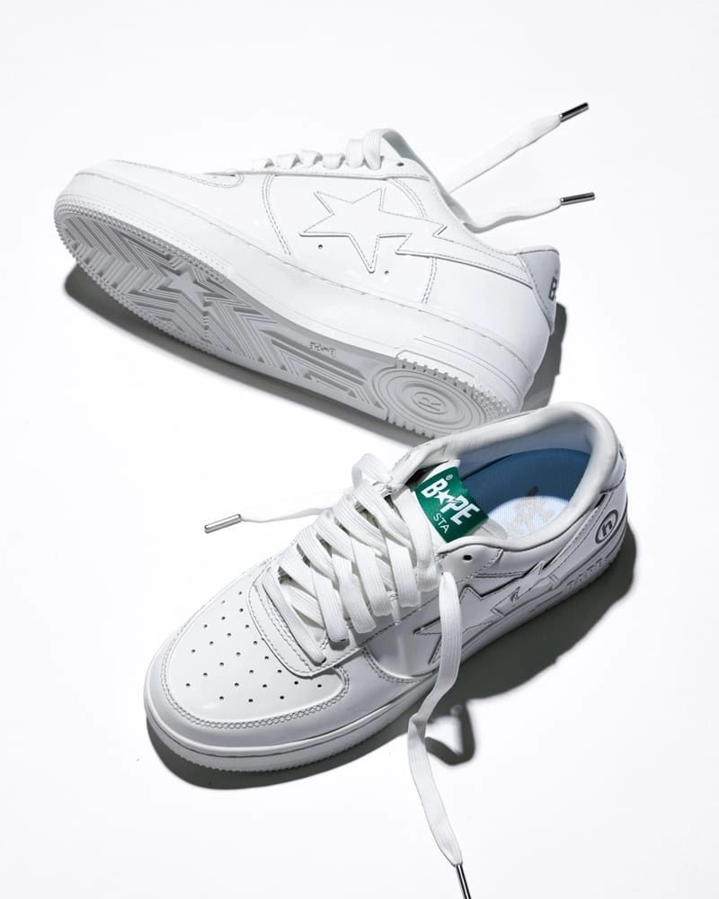 Pair of BAPE STA Hidden NY in smooth white leather with signature green tongue