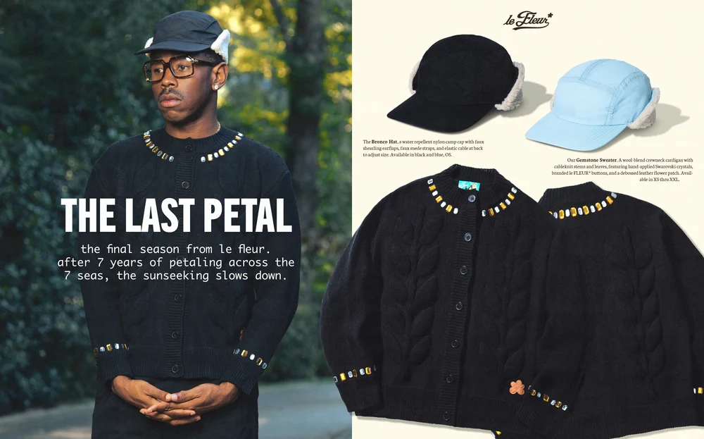 Cardigan noir Le Fleur saison 4 avec ornements et deux casquettes exposées, une noire et une bleue