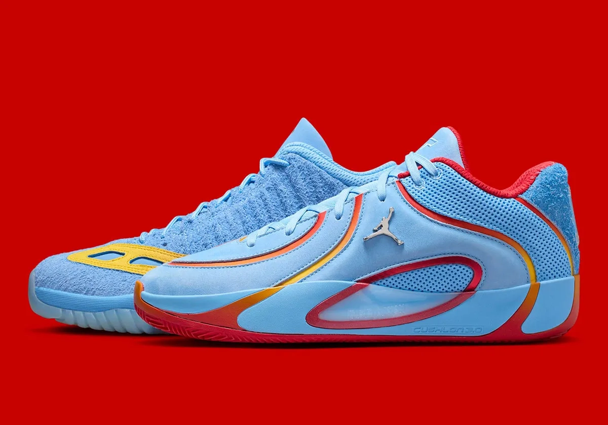 side profile of blue Air Jordan sneaker with red and yellow accents on a red background