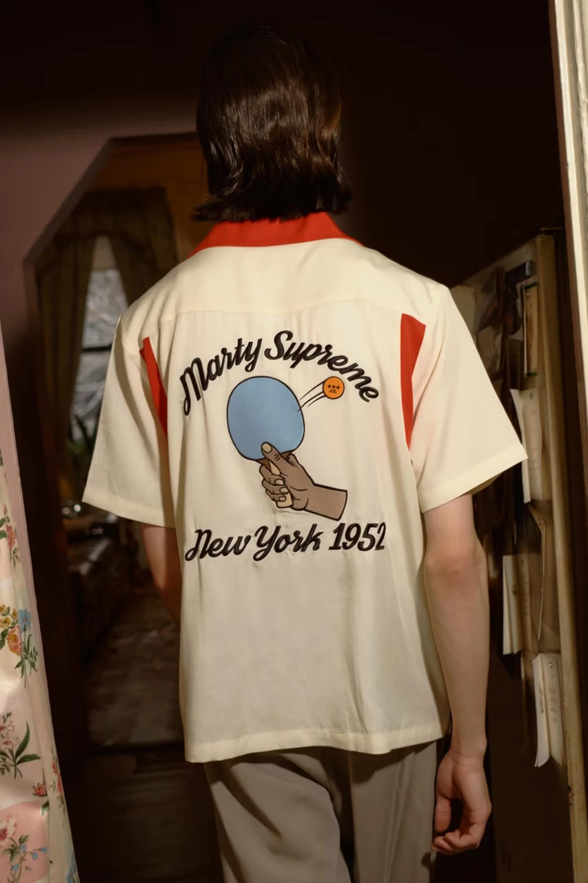 Golf Wang's Marty Supreme Collection man wearing beige polo from behind