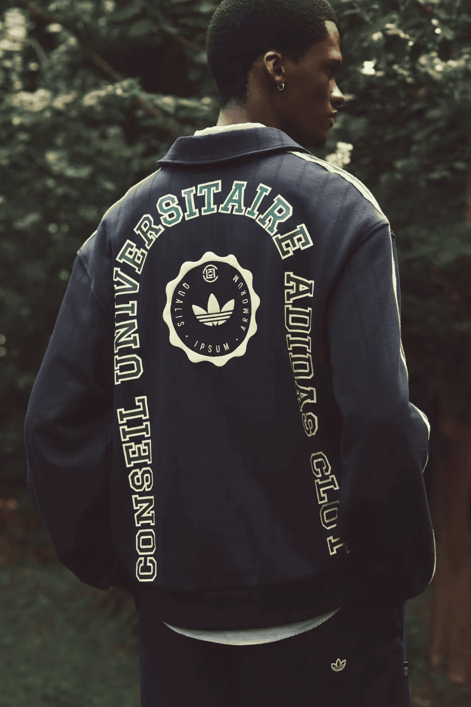 CLOT x adidas blue jacket, back view, with printed university logo