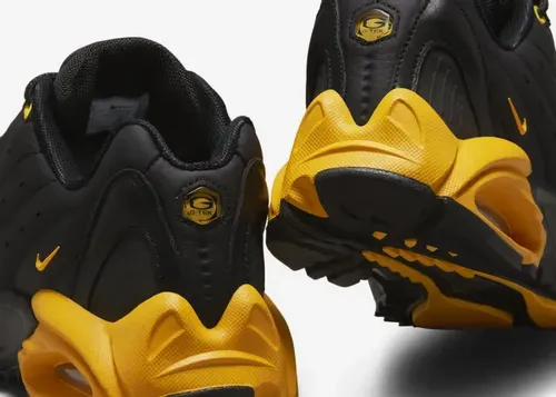 nocta-nike-hot-step-air-terra-black-university-gold-dh4692-002 11.webp